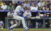  ?? JACK DEMPSEY – THE ASSOCIATED PRESS ?? The Dodgers' Max Muncy watches the flight of his solo home run off Rockies starter Kyle Freehand in the sixth.