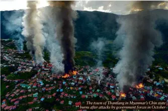  ?? ?? The town of Thantlang in Myanmar’s Chin state burns after attacks by government forces in October