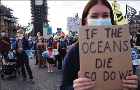  ?? Picture: DAVID CLIFF/PA ?? A BRIDGE TOO FAR: Extinction Rebellion protesters crossing the Thames at Westminste­r last week