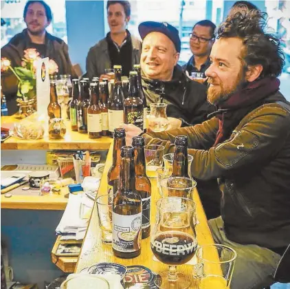  ??  ?? Punters sample the brews on offer at this year’s Paris Beer Week.