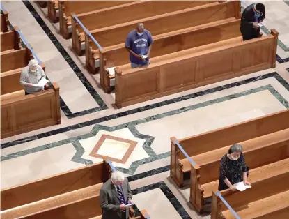  ?? GETTY IMAGES ?? Worshipper­s celebrate Mass at the Basilica of the National Shrine of the Immaculate Conception in Washington D.C. in 2020. A Gallup Poll released this week finds for the first time that most Americans do not belong to a religious congregati­on.