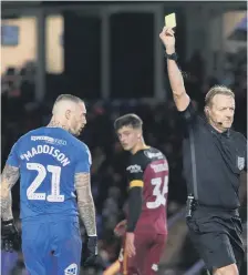  ??  ?? Referee Trevor Kettle shows Marcus Maddison a yellow card for diving.