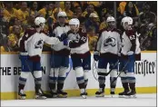  ?? ?? Avalanche left wing Gabriel Landeskog (92) is congratula­ted after scoring his third goal of the game during the second period of Game 3of a first-round playoff series against the Predators on Saturday in Nashville, Tenn.