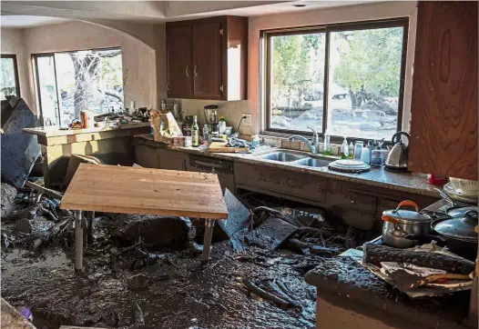 ?? — Reuters ?? Need for massive clean-up: The damage seen in the kitchen of a home on Glen Oaks Road in Montecito, California.