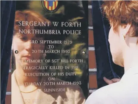  ??  ?? Sgt Bill Forth’s widow Gill looks at a memorial to her husband at Northumbri­a Police headquarte­rs in 1993.