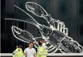  ?? AP ?? Police speak to a shellfish export truck driver as he is stopped for an unnecessar­y journey in London after a protest in Downing Street.