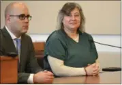  ?? ERIC BONZAR — THE MORNING JOURNAL ?? Janet Tyburski, of Lakewood, appears in Lorain County Common Pleas Court Judge John Miraldi’s courtroom, alongside her attorney Nicholas Hanek, April 5. Tyburski, 47, pleaded guilty to an amended indictment, and was sentenced to 19 years to life for...