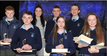  ??  ?? Junior Category winners Kara O’Connor, Joseph Gillen, Aaron Rafferty, Kara O’Connor, Ciara Donnelly, Philip McQuillan and James McMahon receive their awards fro guest speaker Eve McCrystal at the Bush Post Primary Annual School Awards for 2018.