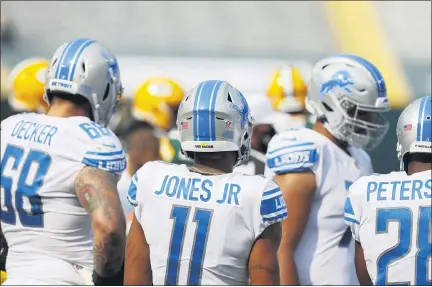  ?? JEFFREY PHELPS — THE ASSOCIATED PRESS ?? Detroit Lions’ Marvin Jones Jr., and his helmet saying End Racismduri­ng an NFL football game between the Detroit Lions and Green Bay Packers, Sunday, in Green Bay, Wis.