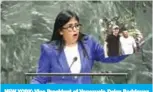  ??  ?? NEW YORK: Vice President of Venezuela Delcy Rodriguez holds up a photo of Venezuelan opposition leader Juan Guaido with a suspected member of the paramilita­ry group ‘Los Rastrojos’ as she addresses the United Nations General Assembly in New York. — AFP