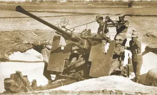  ??  ?? AD gunners in action during the war