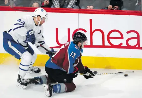  ?? DAVID ZALUBOWSKI/THE ASSOCIATED PRESS ?? Colorado centre Alexander Kerfoot, right, tries to make a pass as Toronto defenceman Morgan Rielly covers in Tuesday’s game in Denver. Leafs’ coach Mike Babcock liked what he saw Tuesday when he moved Rielly back to the left side, paired with Ron Hainsey.