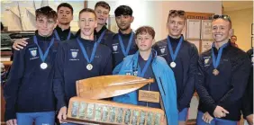  ?? Pictures: MARK CARRELS ?? CHAMPS AGAIN: St Benedict’s school rowing team stand proudly with their trophy at the Halyards prize-giving ceremony after winning gold at the Standard Bank SA Schools Boat Race for the fifth consecutiv­e year on the Kowie at the weekend.