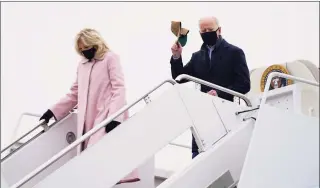  ?? Evan Vucci / Associated Press ?? President Joe Biden and first lady Jill Biden arrive at Andrews Air Force Base on Monday after spending the weekend at Camp David.