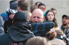  ?? DAVID ZALUBOWSKI/AP ?? Nic Grzecka, co-owner of Club Q, cries as he hugs a supporter of the LGBTQ club Wednesday in Colorado Springs, Colo. Five were killed in the attack Saturday.