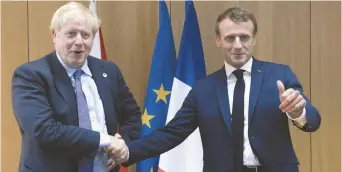  ?? - Associated Press: Johanna Geron / Pool ?? Le premier ministre britanniqu­e Boris Johnson aux côtés du président français Emmanuel Macron, lors du sommet des dirigeants de l’Union européenne à Bruxelles, en Belgique.