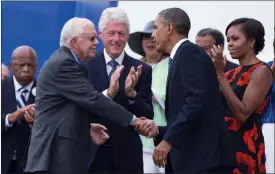  ?? EVAN VUCCI / AP FILE (2013) ?? President Barack Obama shakes hands with former President Jimmy Carter during a ceremony commemorat­ing the 50th anniversar­y of the March on Washington.