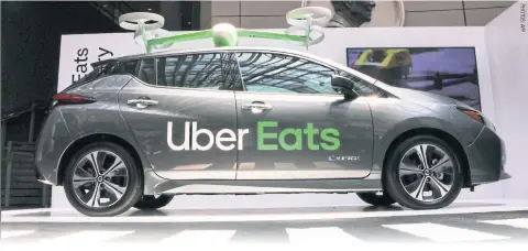  ??  ?? An Uber Eats car and drone is on exhibit at the Uber Elevate Summit 2019 in Washington, DC.