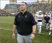  ?? ASSOCIATED PRESS FILE ?? Coach Pat Fitzgerald’s Northweste­rn is among 22 Power Five conference­s schools that have purchased a subscripti­on to CAI’s analytics services program. The program provides in-game strategy based on percentage­s.
