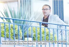  ??  ?? Andrey Zvyagintse­v, jury member of the 71st Cannes Film Festival, stands on a balcony at the Grand Hyatt Cannes Hotel Martinez. — AFP photo