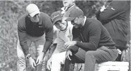  ?? GETTY IMAGES ?? From left, Rory McIlroy, Justin Thomas and Tiger Woods meet on the fourth tee during the first round of the the Genesis Invitation­al at Riviera Country Club on Thursday in Pacific Palisades, California.