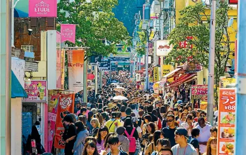  ?? ISTOCK ?? Takeshita St is a mecca for bizarre and dazzling fashion and is popular with young Japanese girls.