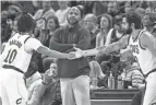  ?? AP ?? Cavaliers head coach JB Bickerstaf­f checks the scoreboard as Cavaliers guard Ricky Rubio, right, enters the game and guard Darius Garland takes the bench on Dec. 10.