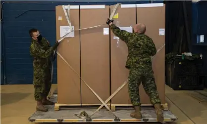  ?? Photograph: Cpl Matthew Tower/Reuters ?? Canadian Armed Forces personnel load freezers for Covid-19 vaccines near the Ottawa airport. on 12 December, a week after Ladislas Kenderesi urged fellow soldiers not to disobey orders.