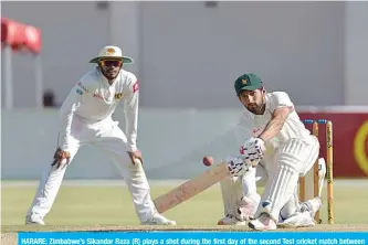  ??  ?? HARARE: Zimbabwe’s Sikandar Raza (R) plays a shot during the first day of the second Test cricket match between Zimbabwe and Sri Lanka at the Harare Sports Club in Harare yesterday. — AFP