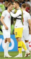  ?? (AP) ?? England goalkeeper Jack Butland, right, comforts England’s Harry Kane, left after the semifinal match between Croatia and England.