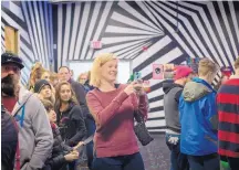  ??  ?? Mahela Sanguinett­i of Virginia takes a picture Wednesday at Meow Wolf’s House of Eternal Return in Santa Fe. The interactiv­e art exhibit is the attraction tagged most on Instagram in the state, according to USA Today.