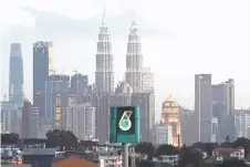  ?? Photo — Bernama ?? For the first nine months of the year, Petronas recorded a profit after tax of RM35.2 billion, more than a 100 per cent increase from the loss after tax of RM19.9 billion in the correspond­ing period last year, in tandem with higher EBITDA, coupled with lower net impairment losses on assets.