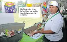  ?? ?? IRENE Govender shows the ‘bath tub’ and washing stone that were used by her family.