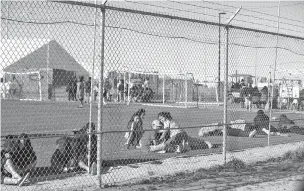  ??  ?? Migrant teens rest Sunday inside the Tornillo, Texas, holding camp, which was opened six months ago as temporary facility but is showing signs of becoming permanent.