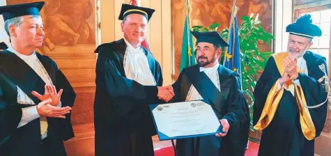  ??  ?? Dr Shaikh Sultan Bin Mohammad Al Qasimi receives the first joint Honorary Doctorate in Urban and Regional Developmen­t from the University of Turin and Polytechni­c University on Friday. WAM