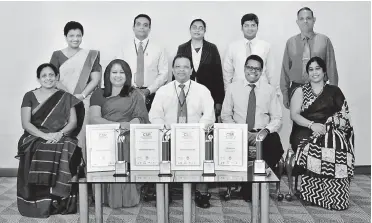  ??  ?? 1: Standing from left: Credit Risk Management Senior Manager Dilunika Jayasinghe, Sustainabl­e Business Officer in Charge Shanel Perera, Talent Developmen­t and Sustainabi­lity Senior Manager Gayathri Ganeshan, HNB Sustainabi­lity Unit V. Disharatna­m and...