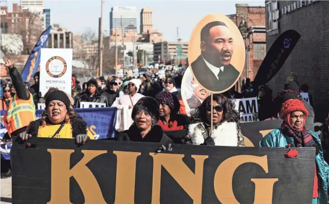  ?? THE COMMERCIAL APPEAL FILE ?? Participan­ts in the annual Martin Luther King Jr. Holiday Parade walk up St. Martin Street toward the National Civil Rights Museum in Memphis on Jan. 21, 2019. This year’s MLK Day “parade” will be virtual due to the COVID-19 pandemic.