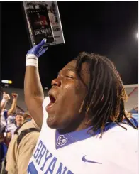  ??  ?? Bryant senior defensive end Nate Wallace celebrates after being given the Brandon Bullsworth award. Wallace had 4 tackles in the game and scored a touchdown after returning a fumble 78 yards with just over a minute left to play.