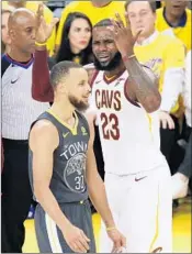  ?? MARCIO JOSE SANCHEZ/AP ?? The Cavaliers’ LeBron James reacts next to the Warriors’ Stephen Curry during Game 2 of the NBA Finals on Sunday.