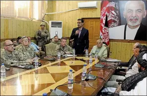  ?? AP ?? The head of NATO troops in Afghanista­n, Gen. Scott Miller (center, left), Kandahar Gov. Zalmai Wesa (center, right) and their delegation­s attend a security conference Thursday in Kandahar, Afghanista­n, before a gunman opened fire, killing Wesa and two other officials.