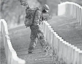  ?? CAROLYN KASTER/ AP ?? At Arlington National Cemetery across from Washington, D. C., before last Memorial Day weekend.