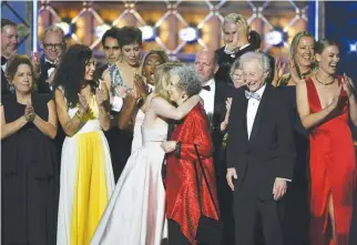  ??  ?? THE CAST and crew of The Handmaid’s Tale accept the award for Outstandin­g Drama Series onstage during the 69th Emmy Awards at the Microsoft Theatre on Sept. 17, in Los Angeles, California.