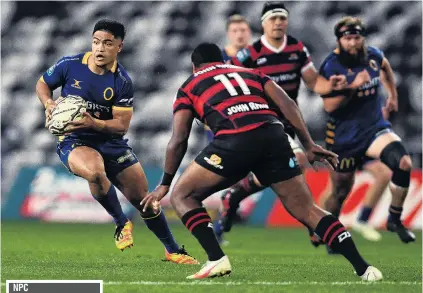  ?? PHOTO: GETTY IMAGES ?? Going for the gap . . . Otago first fiveeighth Josh Ioane looks to sidestep Canterbury winger Manasa Mataele during the round eight NPC match at Forsyth Barr Stadium in Dunedin last night.