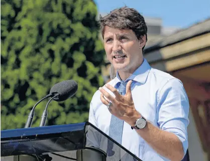  ?? ANDREJ IVANOV/REUTERS ?? Canada’s Prime Minister Justin Trudeau speaks about a watchdog’s report that he breached ethics rules by trying to influence a corporate legal case, at the Niagara-on-the Lake Community Centre in Niagara-on-the-Lake, Ont., Aug. 14.
