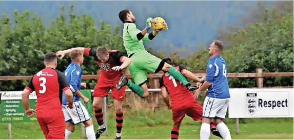  ?? Picture: Peter Langley ?? The Ruardean Hill Rangers goalkeeper claims the ball under pressure from two Shirehampt­on players in last Saturday’s Gloucester­shire County League game, which ended in a 5-1 victory for visitors Shirehampt­on