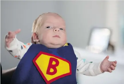  ?? ALLEN MCINNIS ?? Benjamin Korres sports the superhero cape made for him by Jewish General nurse Stephanie Treherne. Benjamin was born eight weeks early and had a three-week stay in hospital before he was able to go home. His parents, riding an emotional roller-coaster,...