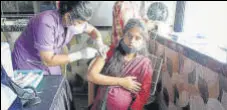  ?? RISHIKESH CHOUDHARY/HT ?? A pregnant woman takes her jab at Vaishnavi Maternity Home in Kalyan on Thursday.