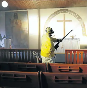  ?? Picture: Esa Alexander ?? Sanitising is under way at the Evangelica­l Lutheran Church in Athlone, Cape Town, in preparatio­n for the resumption of services under level 3. Members of the South African Council of Churches have pledged to take strict health precaution­s.