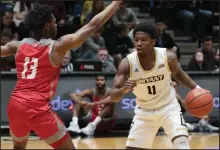  ?? Photo by Victoria Brenchak/Bryant Athletics ?? Adam Grant, guarded here by Sacred Heart’s Chaylyn Martin (13), scored a game-high 24 points but it wasn’t enough as Bryant fell to the Pioneers, 83-76, on Sunday afternoon.