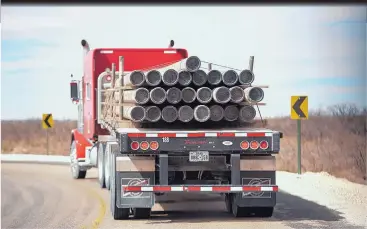  ?? ROBERTO E. ROSALES/JOURNAL ?? Big trucks transport heavy drilling equipment around southeaste­rn New Mexico’s oil patch. The area’s truck traffic has damaged public roads and created dangerous conditions, resulting in an increased number of accidents.